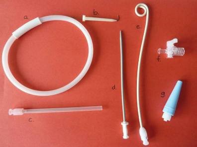 Equipment laid out and marked with corresponding letters.